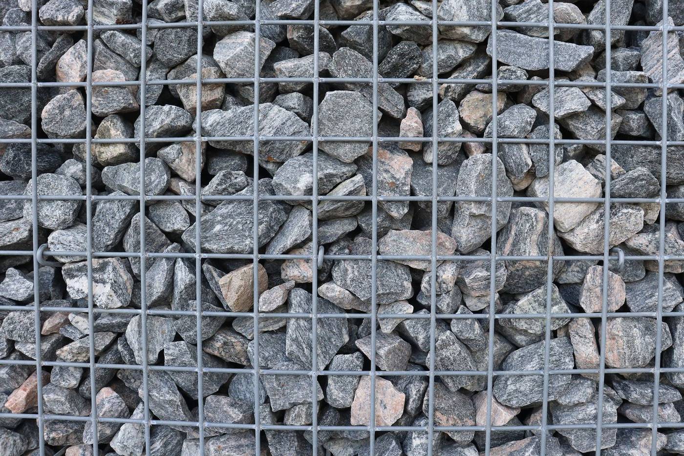 Close-up of stone fill held in a wire mesh wall